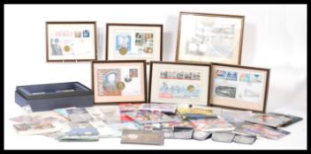 A large collection of vintage coin covers and coin packs some being framed. FDC's coin covers also