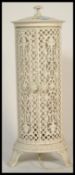 A decorative 20th century cast metal and painted lattice cylindrical conservatory heater upright
