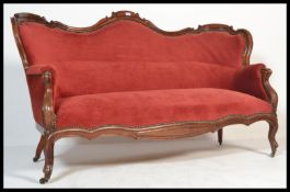 A Victorian mahogany double scroll end Chesterfield sofa settee. Raised on castors with scrolled