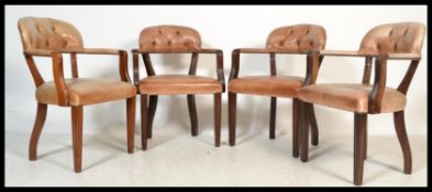 A set of four 20th century Chesterfield type leather button back boardroom gainsborough style desk