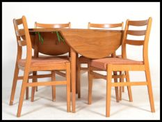 A mid century retro drop leaf formica faux wood kitchenette dining table with drop leaves together