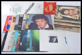 A collection of vinyl long play LP records featuring various artists dating from the 1960's to