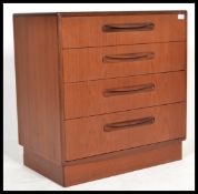A 1970's G-Plan teak wood Kelso Pattern chest of drawers being raised on an inset plinth with
