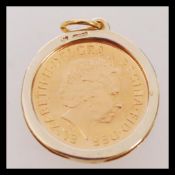 A full sovereign pendant having a 2001 full sovereign coin in a 9ct gold necklace pendant mount.