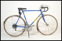 A vintage retro 20th century Eddy Merckx bicycle bike on vintage frame with drop handlebars.