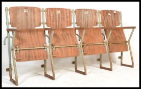 A set of four vintage Industrial mid  20th century cinema - theatre chairs. Set on a metal tubular