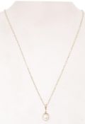 A 9ct gold pendant with a pearl and round spring clasp. Item weighs 2.3 grams.