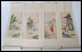 A group of four vintage 20th century Chinese scrolls having panting on silk panels depicting