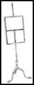 A George V silver hallmarked novelty photograph frame modelled as a Georgian tripod pole screen