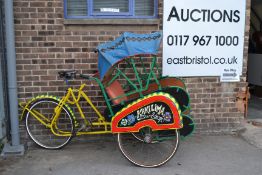 A full sized 20th century Philippine Islands ( Hanoi ) bicycle rickshaw in working order painted