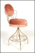 A retro vintage 20th century bedroom boudoir wire work dressing table chair having a scroll work