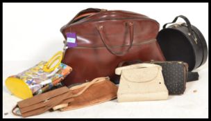 A collection of vintage bags of varying sizes and materials including clutch bags,leather shoulder