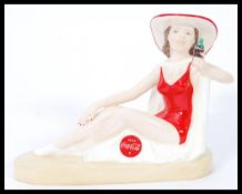 A Royal Doulton Advertising ceramic figurine Coca-Cola Sunbather MCL16. Limited edition 24/750.