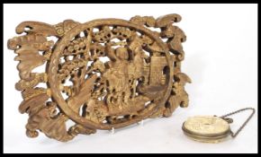 An early 20th Century wooden carved wall decoration plaque depicting a Japanese Warrior with his