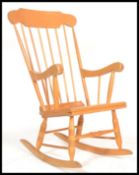 A 20th century contemporary antique style windsor rocking chair on sleigh runners with shaped