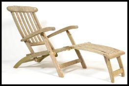 Lindsey Teak - A teak and brass weathered steamer chair having slatted teak and multi positional