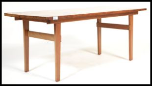 A vintage retro 20th century teak coffee table raised on tapered square supports. Measures: 46cm