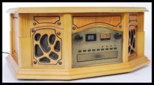 A contemporary antique style hi-fi stereo system in oak wooden effect, The system comprising tape