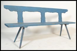 A vintage 20th century continental large wooden painted pine settle bench raised on angular