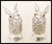 Pair of contemporary 800 continental silver condiment vessels with beaded glass eyes in yellow and