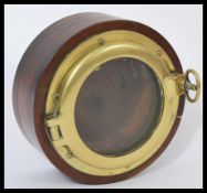 An unusual wall lamp dating to the mid century constructed from the centre of an aeroplane prop