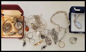 A group of sterling silver jewellery to include heart padlock bracelet, amber type necklace and