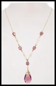 A vintage Ward Brothers Art Nouveau style 9ct carat gold plated purple stone drop necklace. Marked