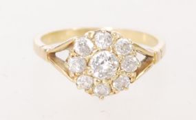 An 18ct gold diamond cluster ring with central diamond approximately 0.25 ct. Weight 3.1 grams.