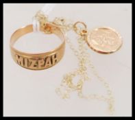 A 9ct gold hallmarked St Christopher pendant set to a fine 9ct gold chain together with a vintage