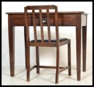 An early 20th Century Edwardian single drawer desk / writing table raised on a tapering square