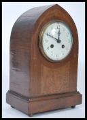 An Edwardian mahogany inlaid spire shaped mantel clock with 8 day brass clock movement, enamel