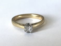 A hallmarked 18ct gold and diamond solitaire ring having a prong set prong princess cut diamond.