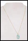 A 9ct gold Egyptian chain with scarab beetle pendant. The chain measures 45cms long. Total weight