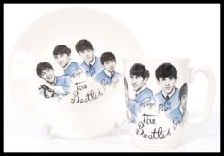 A vintage 20th century 1960's Beatles mug & plate printed with an image of the Fab four by