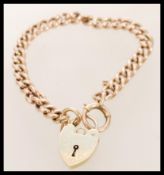 A good 9ct gold bracelet and heart shaped padlock, hallmarked 9ct gold with each link also