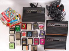 COLLECTION OF VINTAGE ATARI VIDEO COMPUTER SYSTEM CONSOLES & GAMES