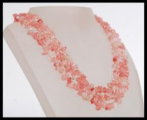 A fine three strand rose quartz graduated necklace