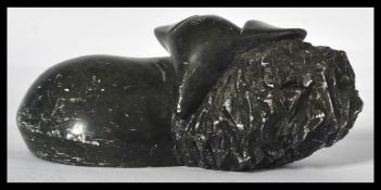 A 20th Century African stone carving of a recumben