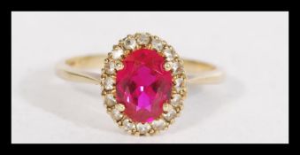 A hallmarked 9ct gold ring set with a central oval