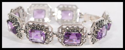 A sterling silver and marcasite amethyst panel bra