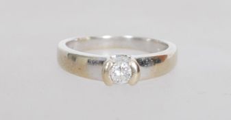 An 18ct white gold diamond ring having a central d