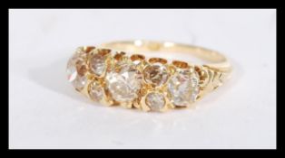 An 18ct gold seven stone diamond ring of approx 1.