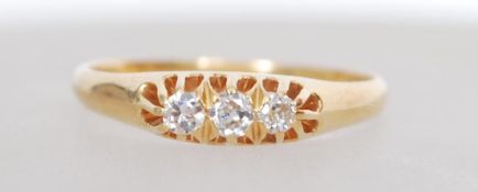 An 18ct gold three stone diamond ring having appro