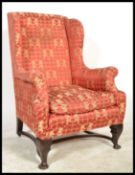 A 19th Century Georgian wingback armchair, the sha