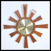 A vintage retro mid century teak starburst sunburs