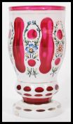 A 19th century Bohemian cranberry glass goblet hav