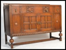 A 1920's Art Deco oak sideboard dresser raised on
