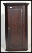 A George III 19th century oak tall hanging corner