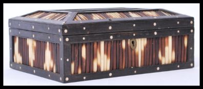 A 19th century porcupine quill worked  ebony and b