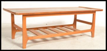 A retro 20th Century teak wood coffee table, centr